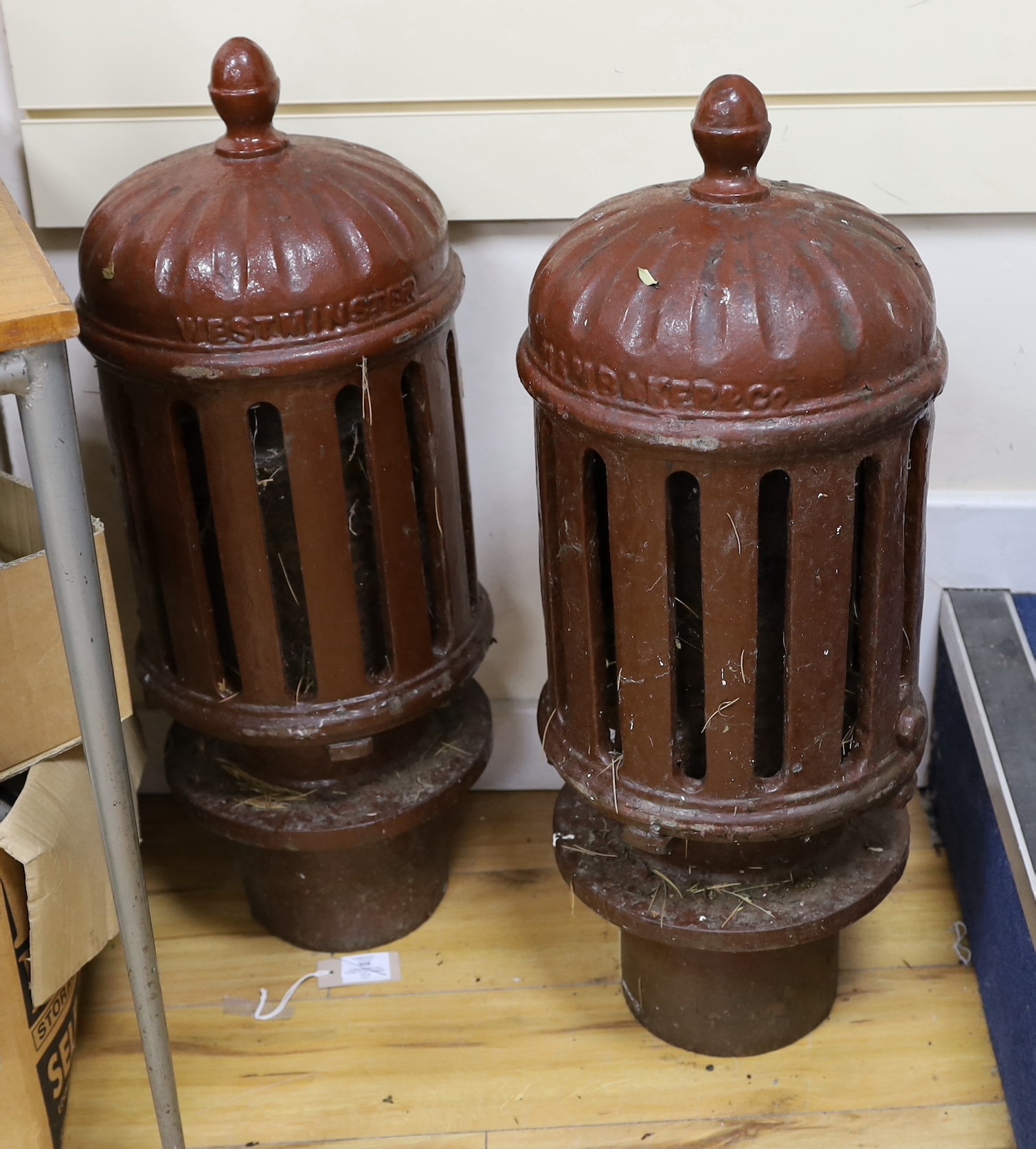 A pair of Ham Baker & Co cast iron finials 75cm